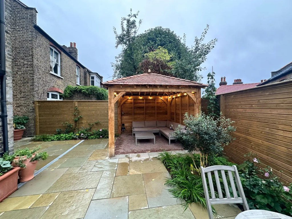 Natural limestone paving in a completed Lewisham garden landscaping project.