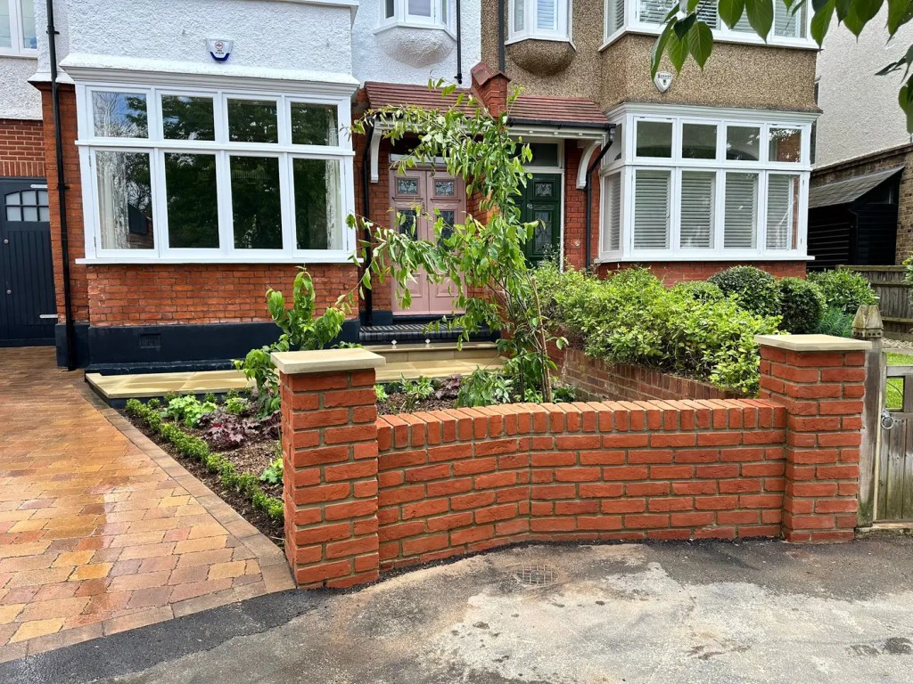 New brick boundary wall designed to complement the existing Dulwich property.