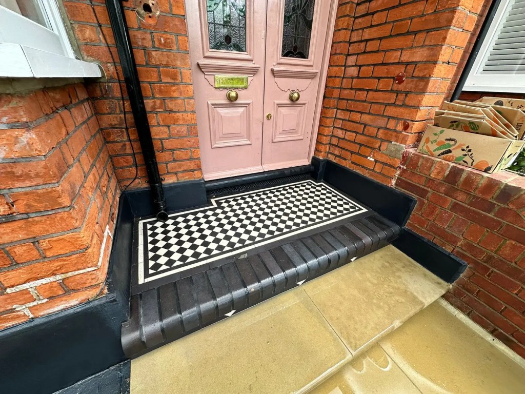 Victorian mosaic doorstep and Yorkstone paving at a Dulwich home entrance.